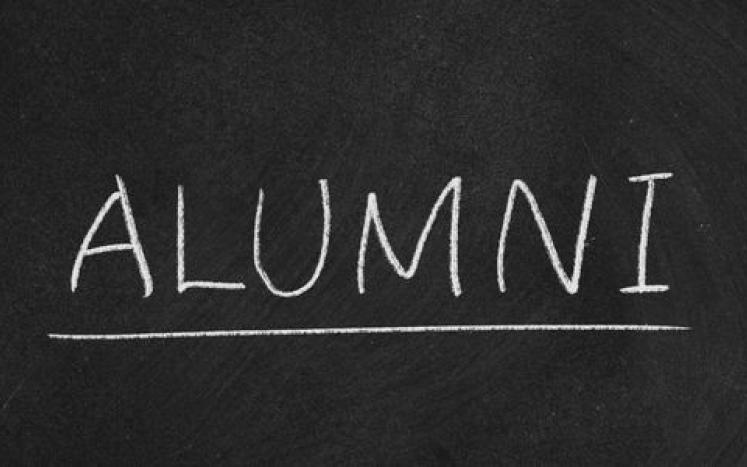 alumni written on chalkboard